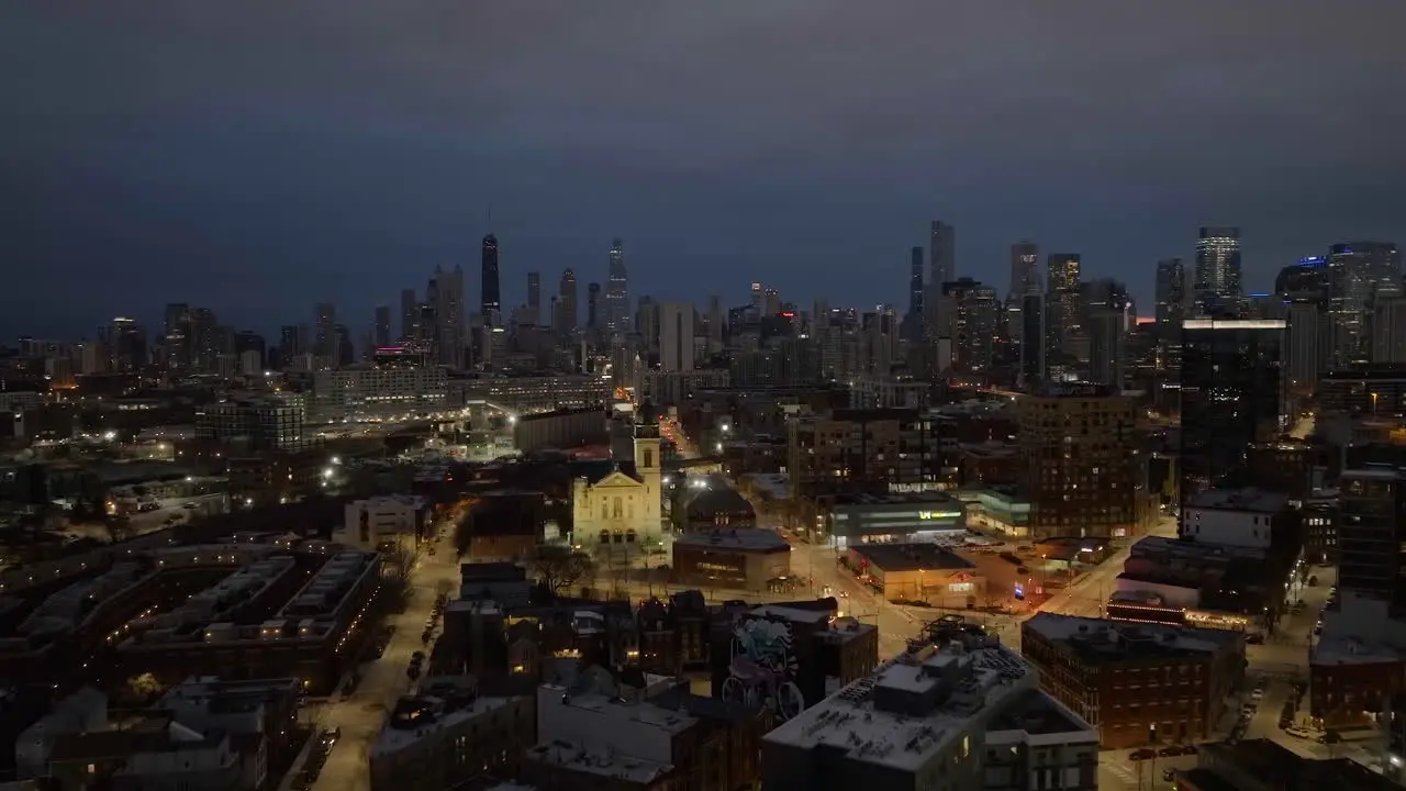 Aerial view approaching the illuminated St