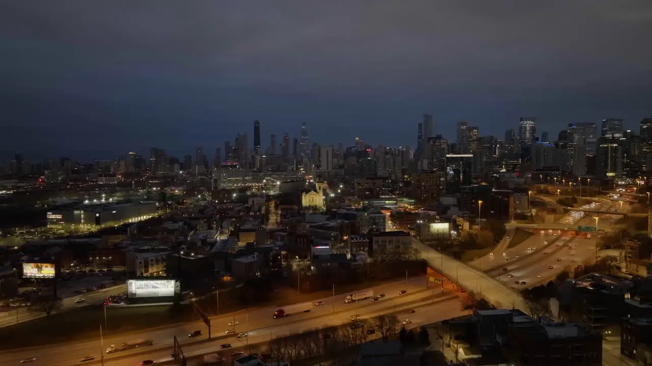 Aerial view over the Interchange 90 towards the illuminated St