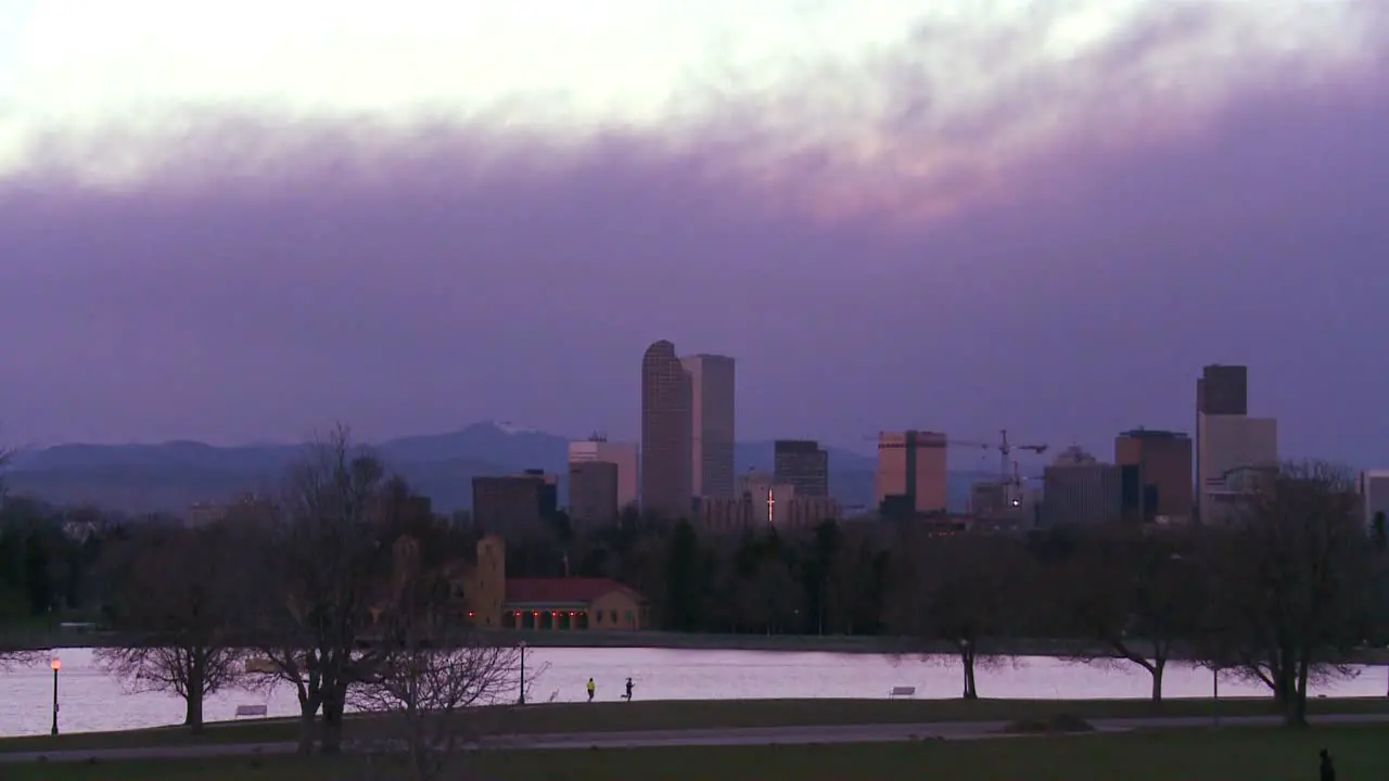 The skyline of Denver Colorado skyline at dusk in purple light