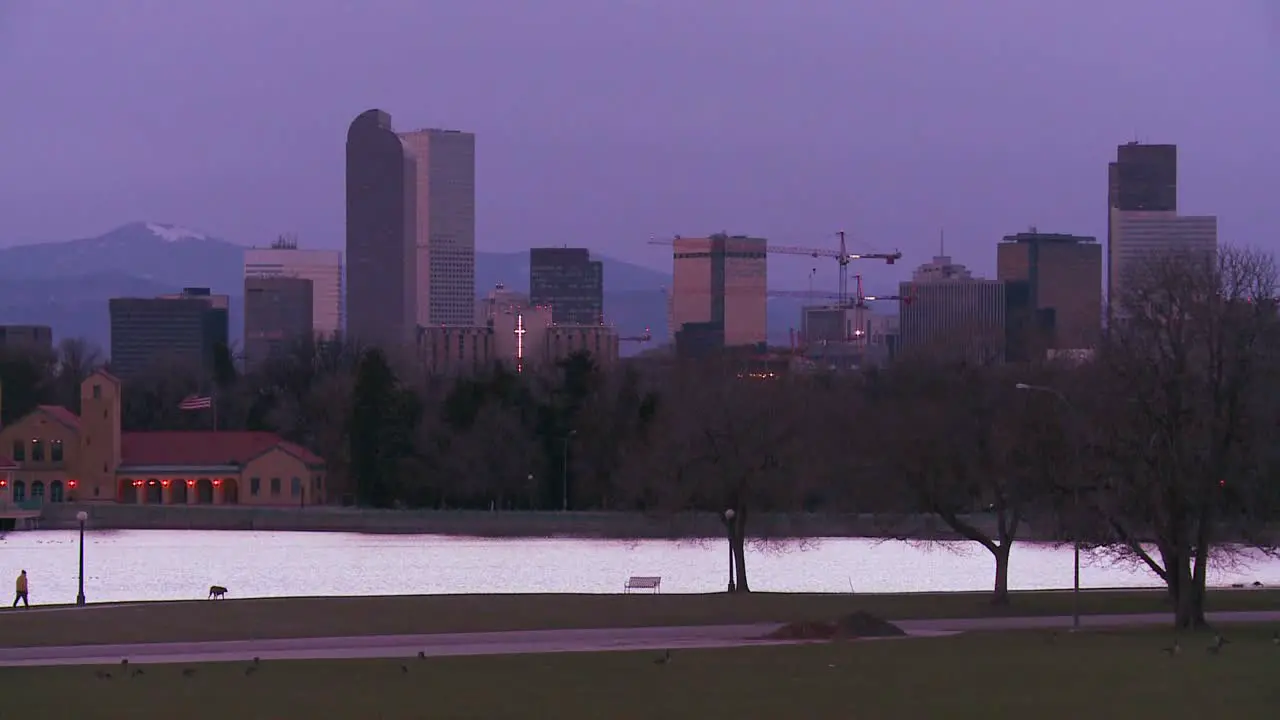 The skyline of Denver Colorado skyline at dusk in purple light 1