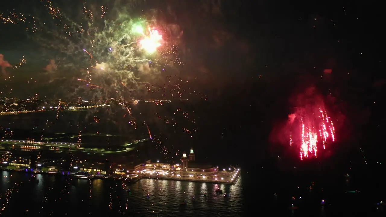 Aerial view panning around fireworks at the Navy pier night in Chicago USA