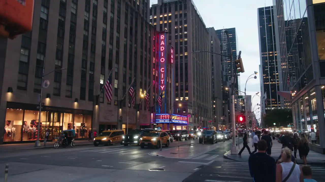 Wide angle view of radio city music hall entrance at dusk