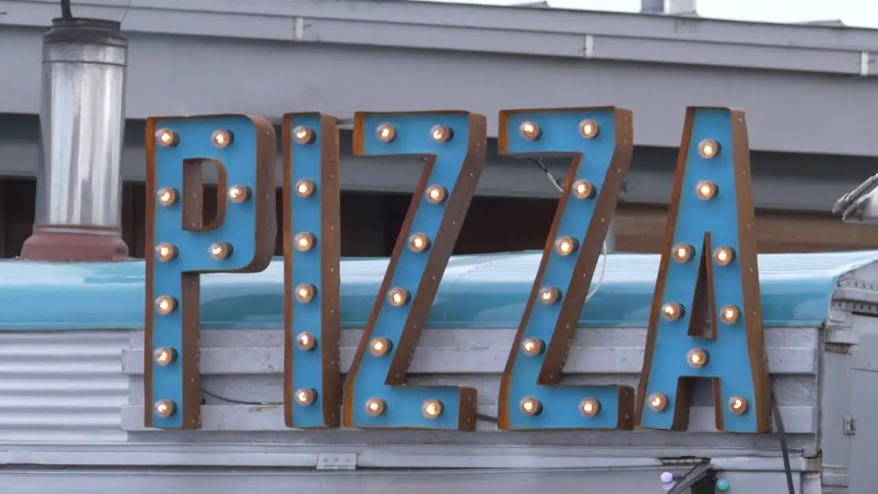 Pizza Sign on a Food Truck filmed at a Food Festival in England