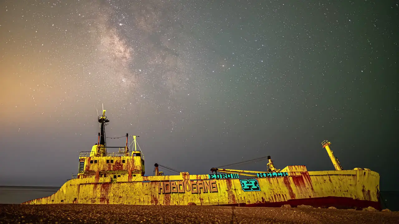 Milky way time lapse above the Edro III shipwreck on Cyprus in the Mediterranean Sea