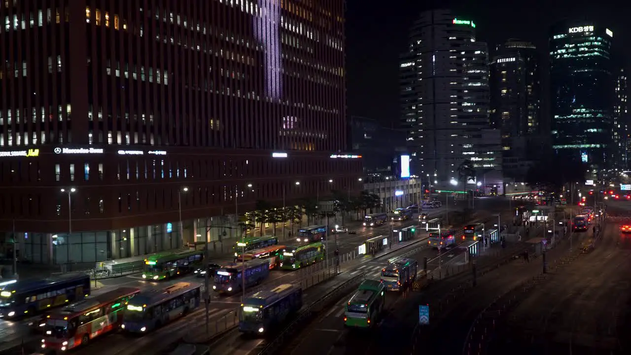 Seoul South Korea city scene at night by the central bus station establishing shot