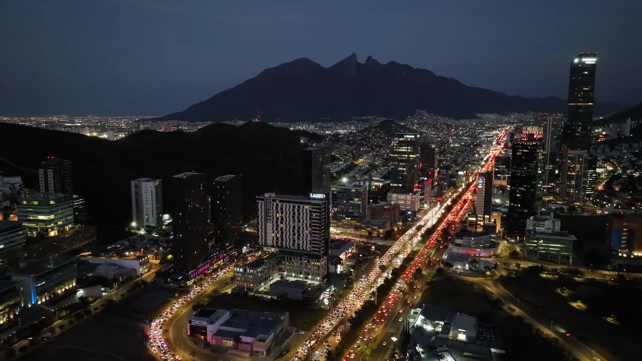 Aerial view towards the Latitud apartment building night in Monterrey Mexico