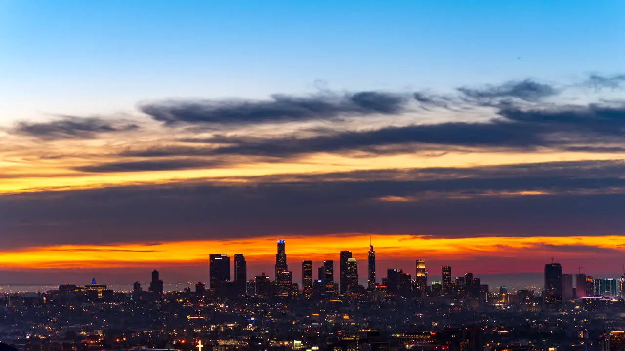 Stunningly colorful sunrise over the Los Angeles skyline night-to-day holy grail wide angle time lapse