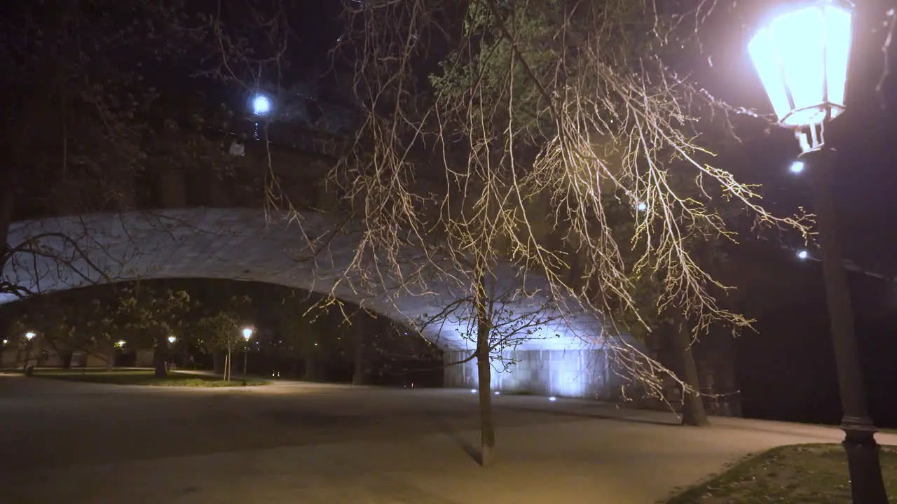 Legion bridge arch over an empty park at night Strelecky island Prague Czechia