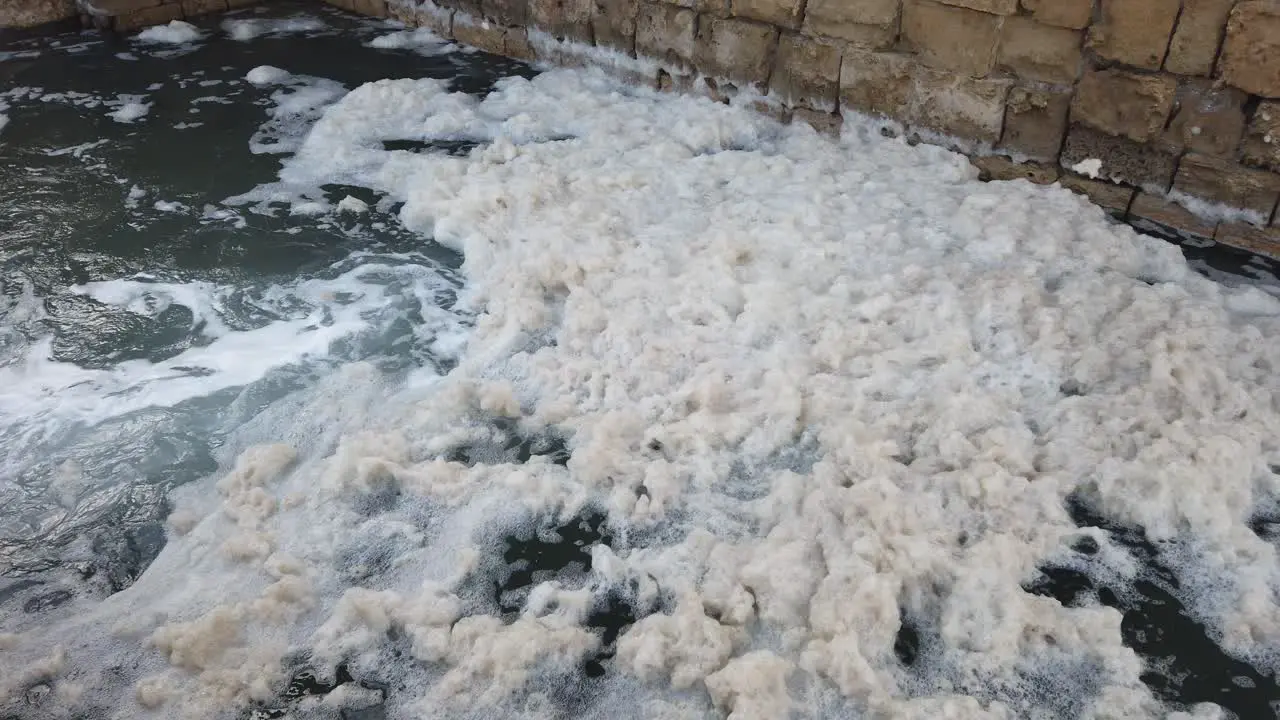 Seafoam in slow motion as it splashes around from the wild Mediterranean sea