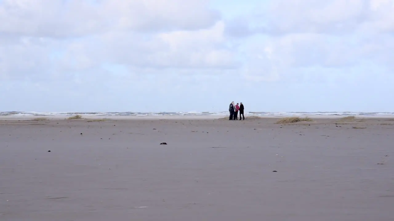 Senior vacationers on a stormy beach