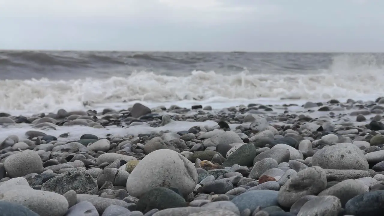 February 2022 storm Franklin crashing harsh waves on English pebble stone beach