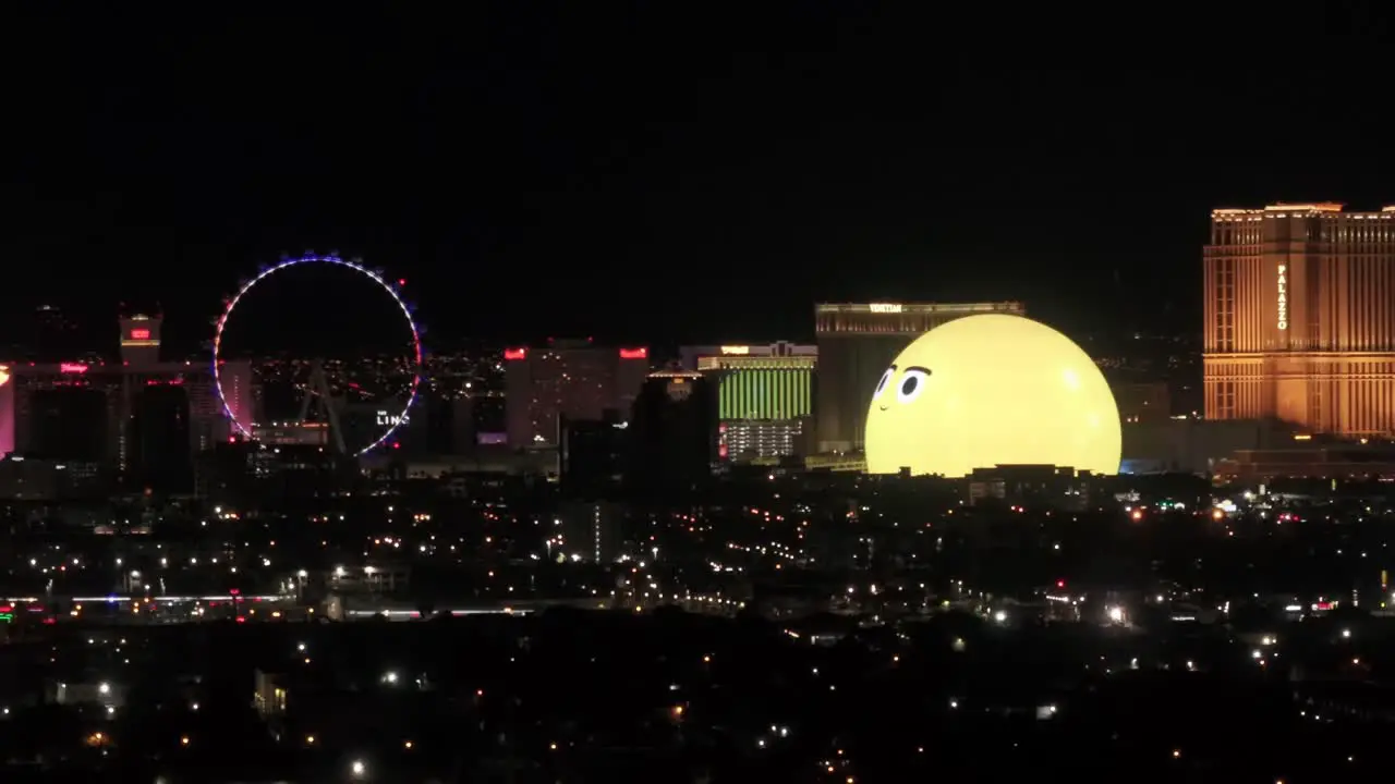 MSG Sphere arena of the emoji face on the Las Vegas strip entertainment of shows concerts music and casinos aerial view at night