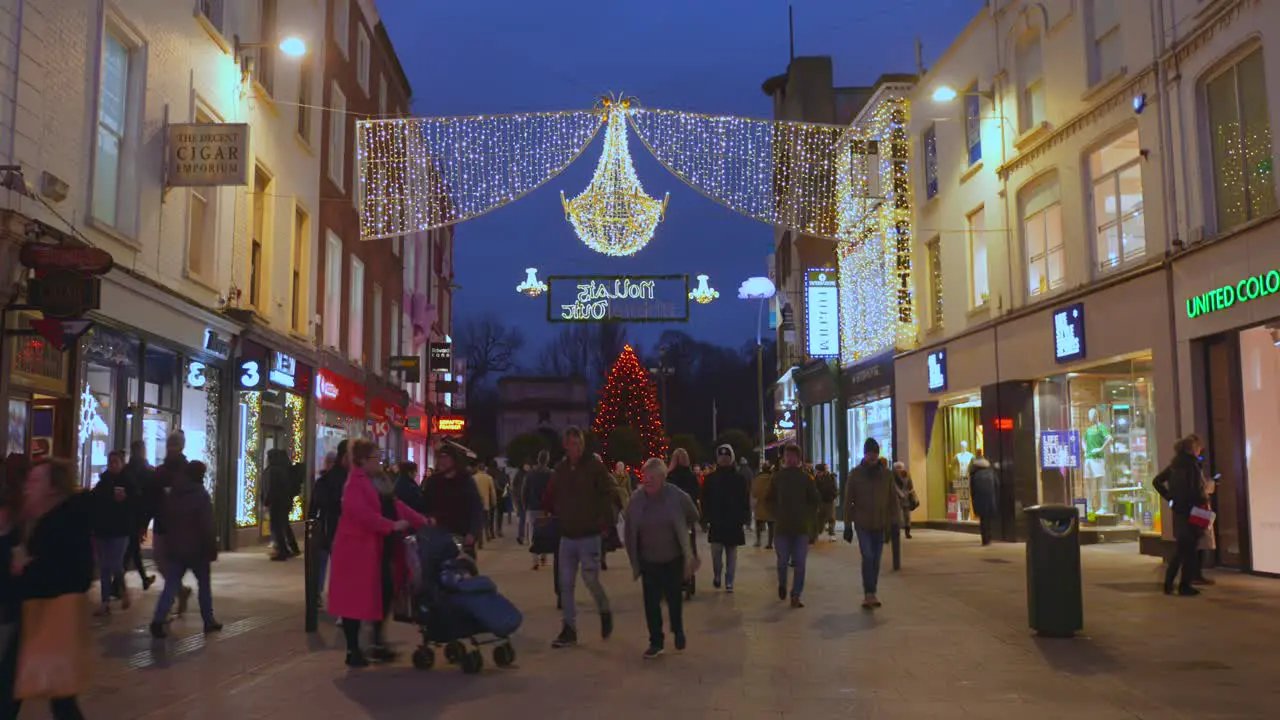 Dublin city shopping street Christmas decoration nighttime people strolling