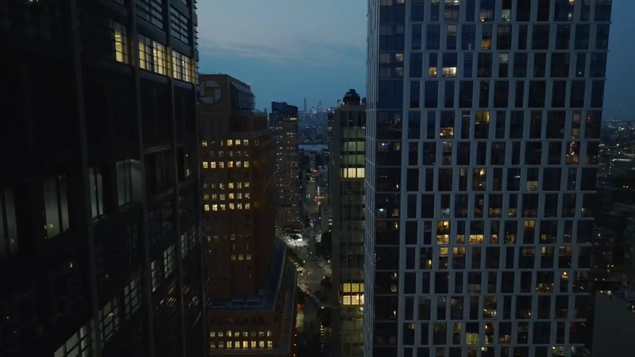 Aerial descending shot of downtown Brooklyn New York at night