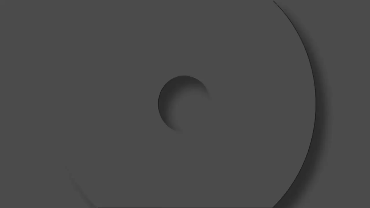 Animation of grey circles and crosses spinning on grey background