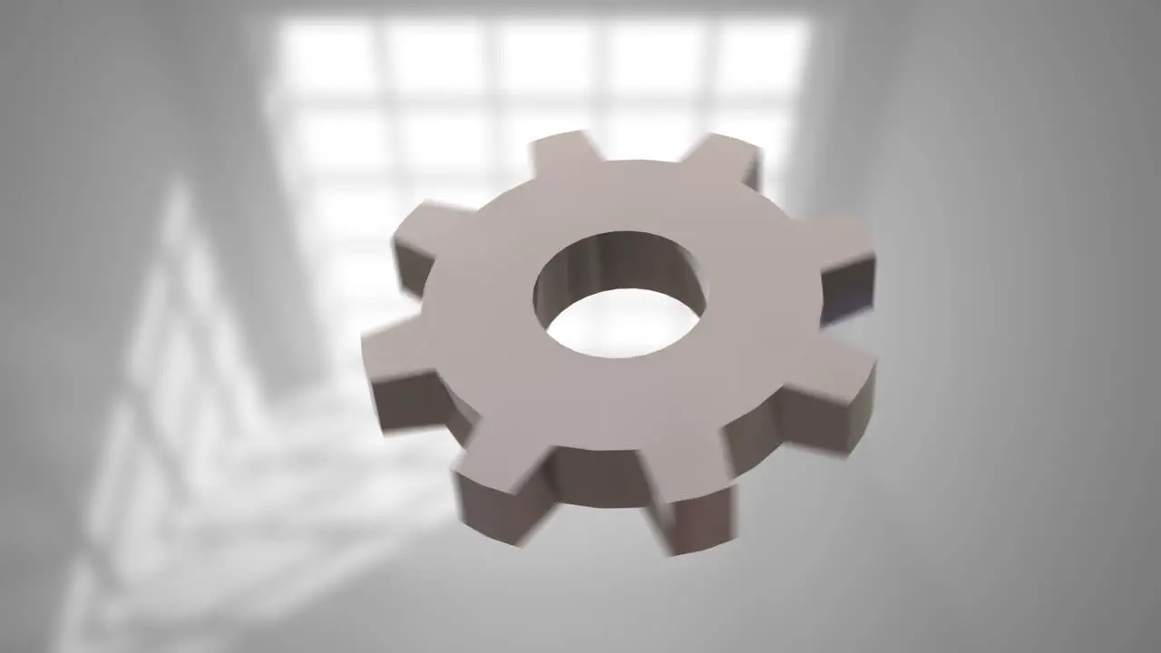 Animation of cog spinning on grey background