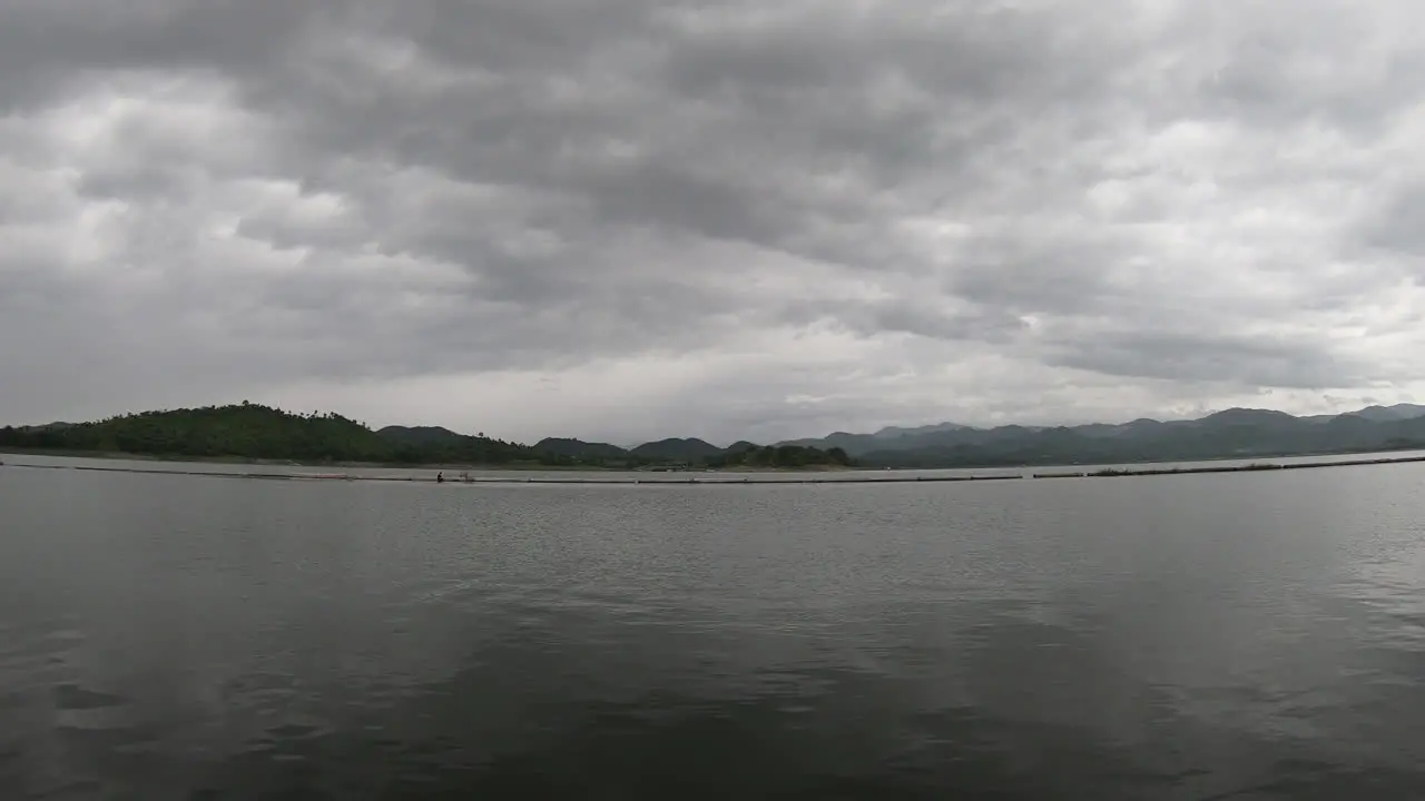 timelapse lake and mountain with cloudy sky