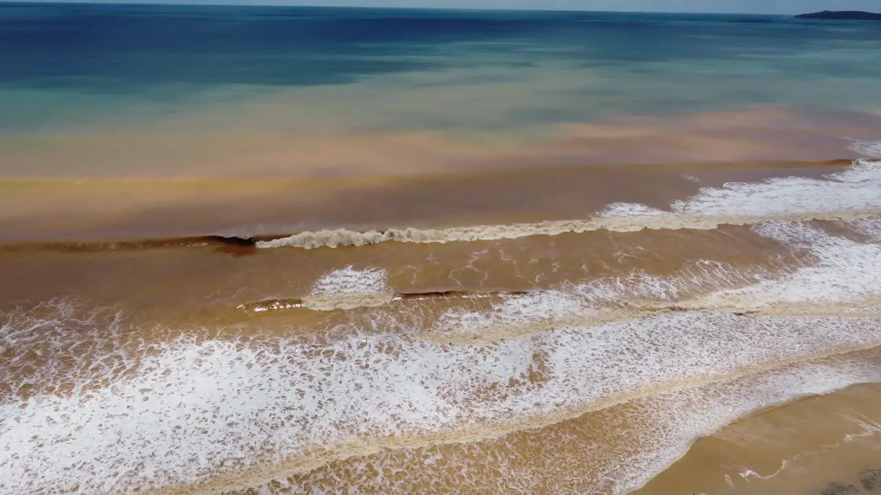 Aerial View of waves of mud on a beach after a massive storm