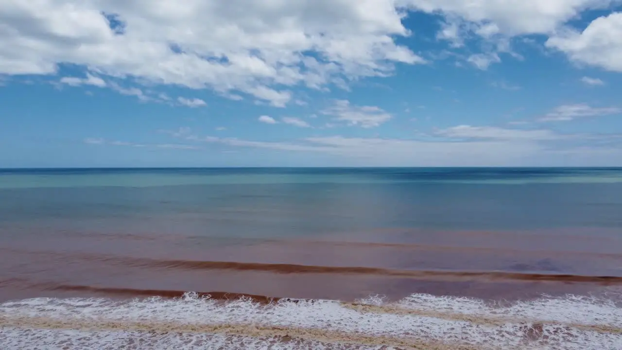 Drone footage of a muddy beach after a cyclone in Australia