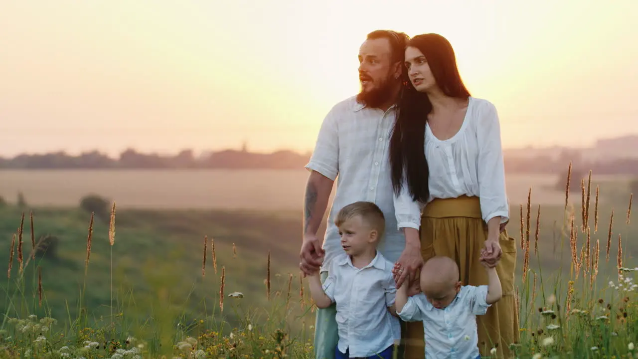 A Young Family Of Farmers Together With Their Children Examine Their Lands And Enjoy The Beauty And 