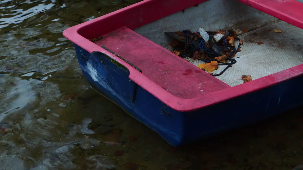 A red boat on the water bank in nature