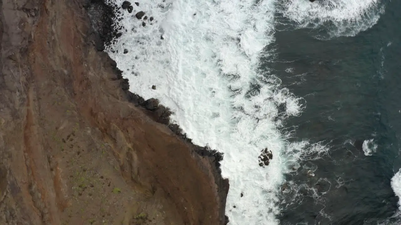 Aerial is ascending counter clockwhise above cliffs of Sao Laurenco Madeira