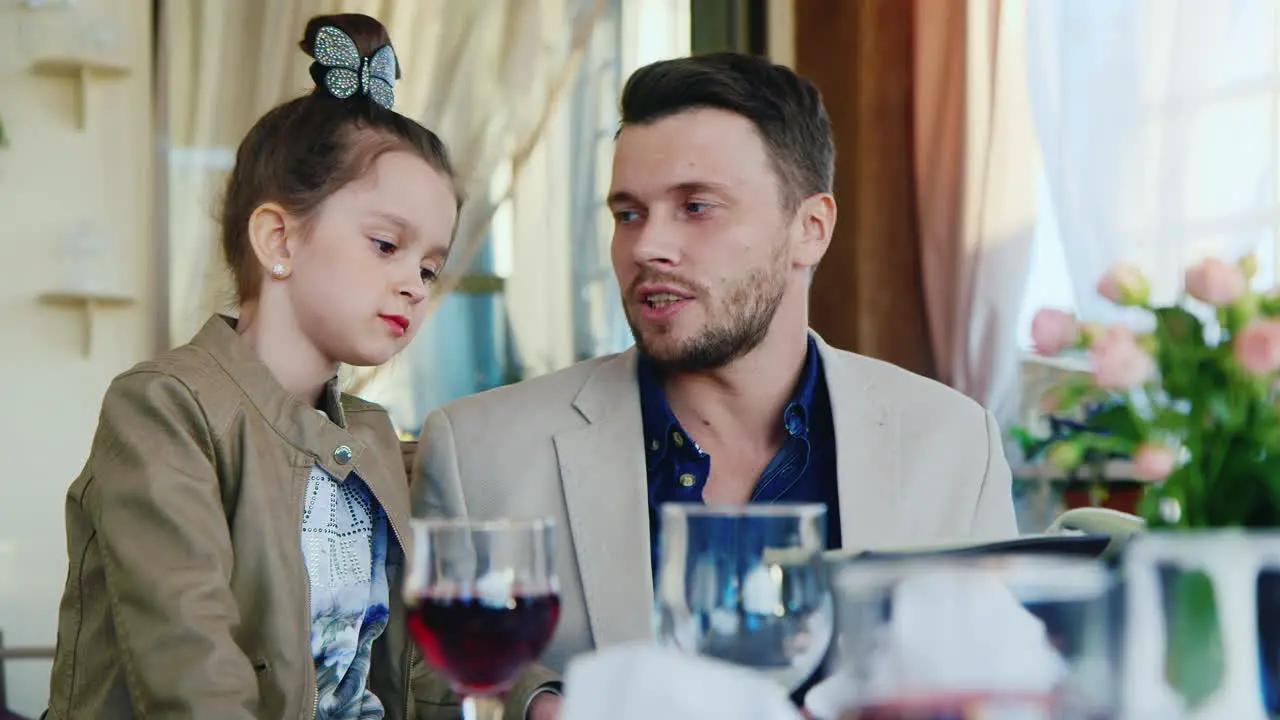 Father and Daughter Read Menu