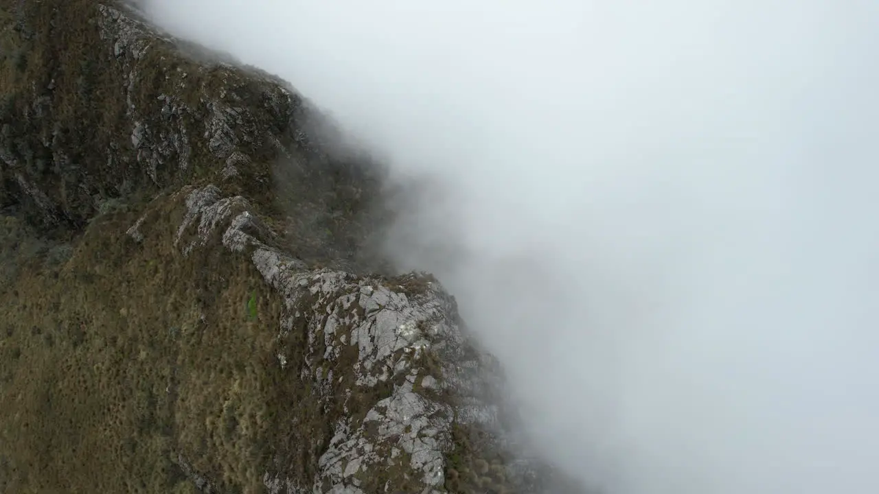 Aerial View of Steep Hills and Dense Clouds Under Rucu Pichincha Volcano Ecuador Drone Shot