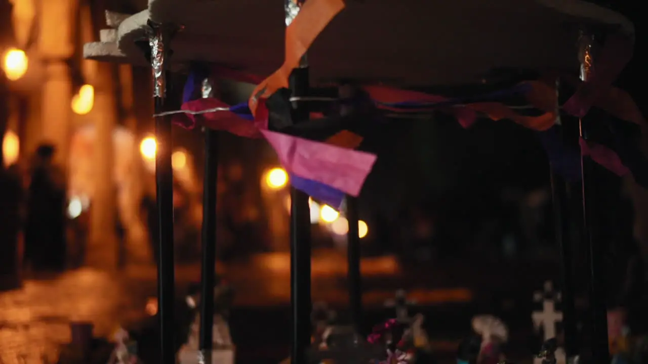 close-up of an altar of the dead on a night with lightning during the celebration of the Day of the Dead in Mexico with skulls