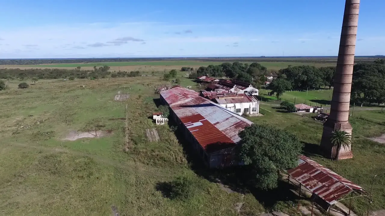 Aerial View of Old Abandoned Factory and Chimney in Rural Landscape of Argentina