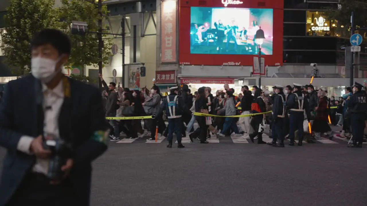 Police Lines Directing People Through Shibuya Crossing on Halloween