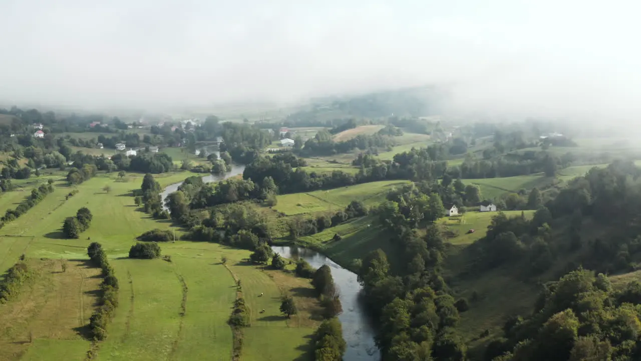 Beautiful farmland and countryside under low fog in European country Bosnia