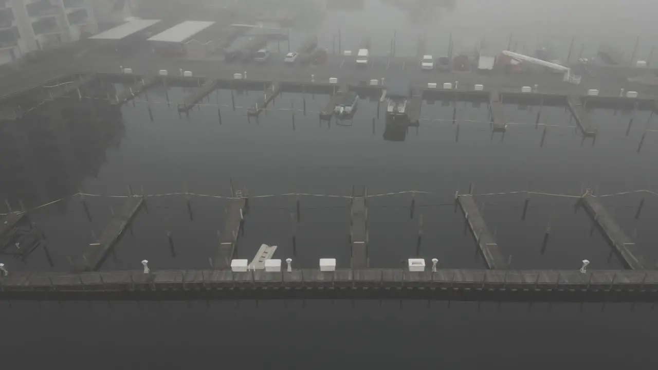 Docks of a small Marina covered in mist