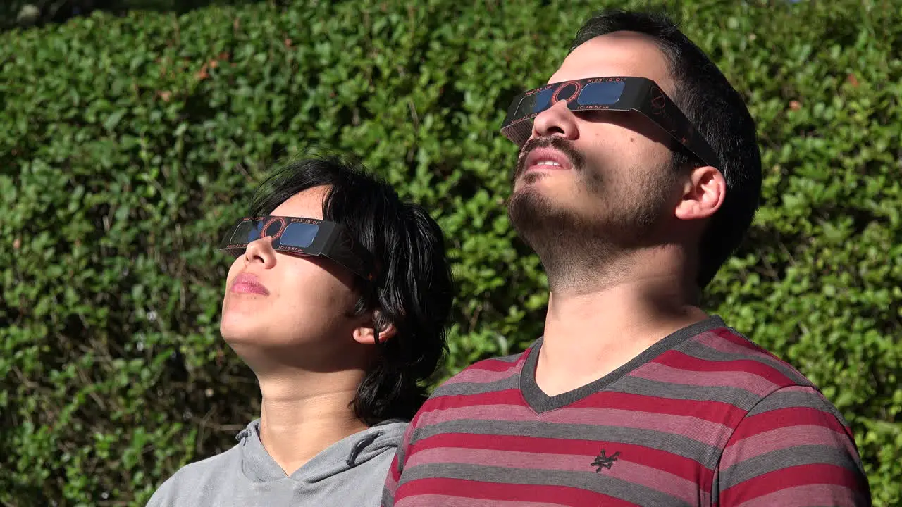 Solar eclipse casts shadows on faces