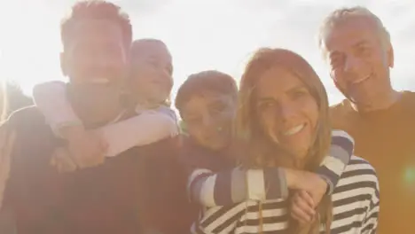 Low Angle Shot of Children Piggy Backing On Their Parents 02