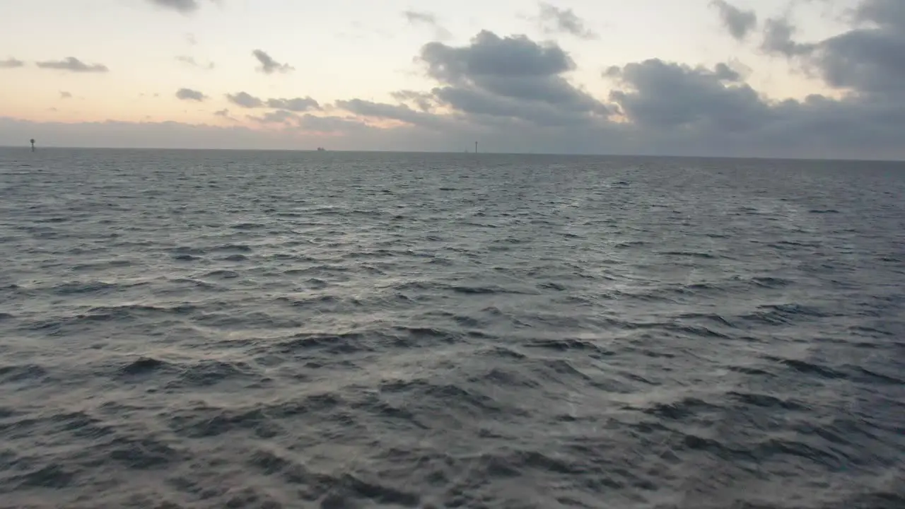 Aerial drone flight over North Sea with waves