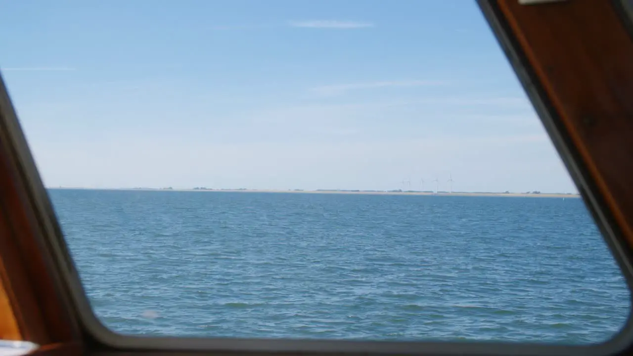 Amazing scenery of the sea through a window of a boat in slowmotion