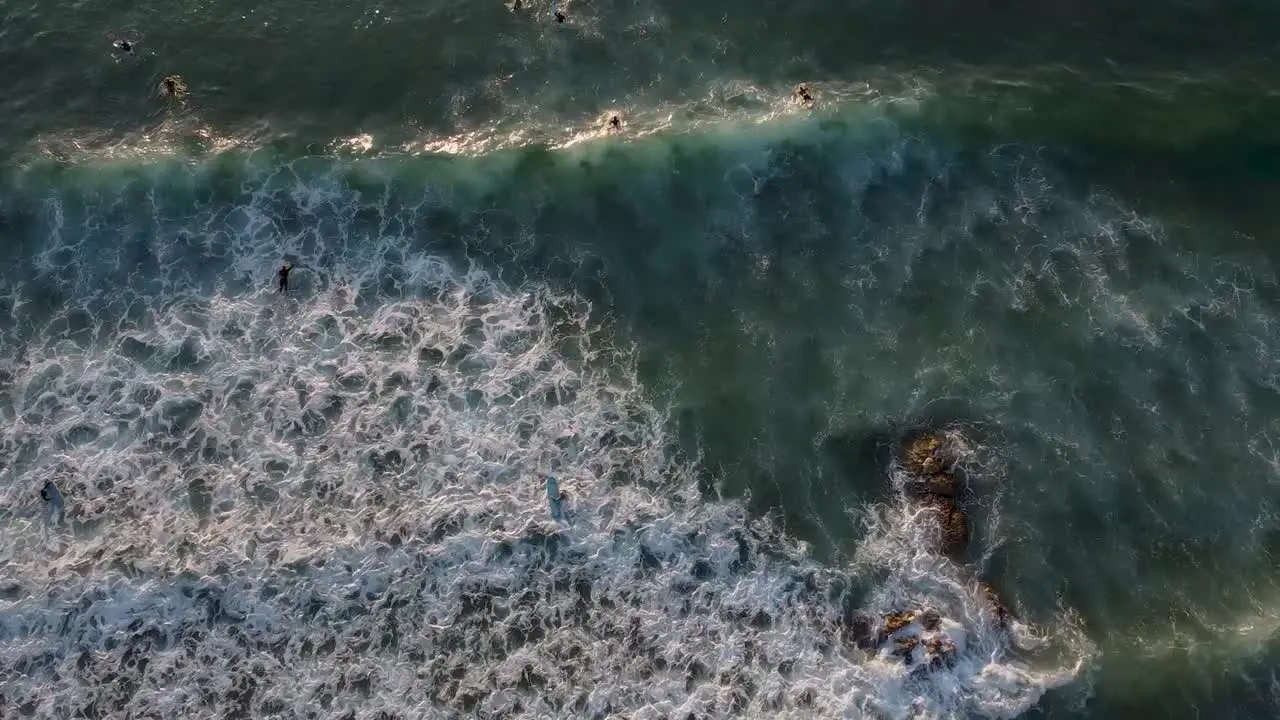 Aerial view of surfers on a beach in Portugal