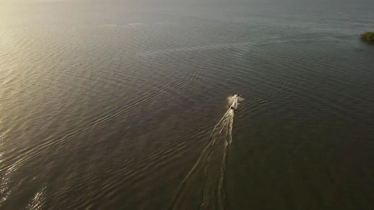 Aerial view of parasailing alone in vast waters of sea