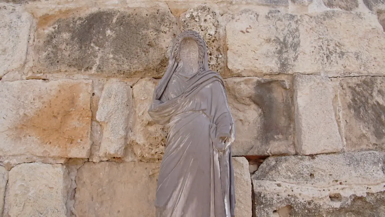 Jesus statue near ancient historical limestone wall in Salamis city Cyprus