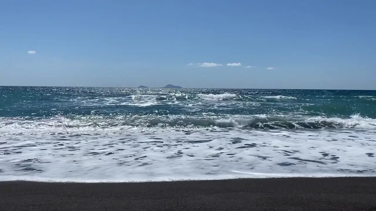 Beautiful Vichada Black Sand Beach in Santorini Greece on a Sunny Day