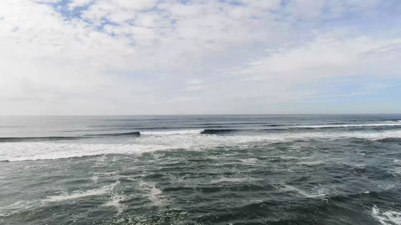 Flying over whitecaps and along the shore at Long Beach in Washington State