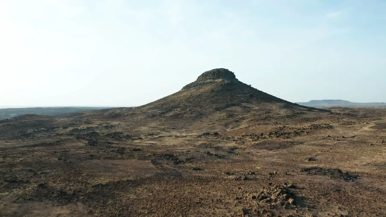 Aerial Flyover Of Arid Region Landscape With Mountain India