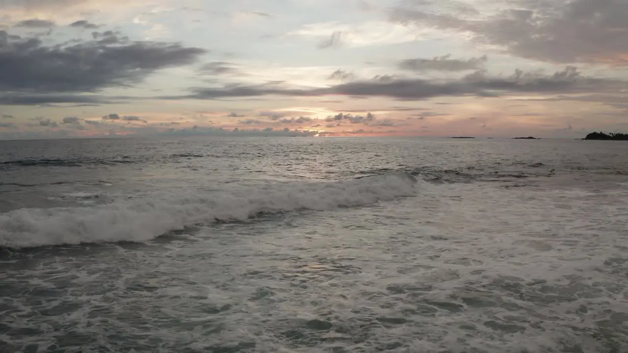 Light orange sunset in the ocean beach background