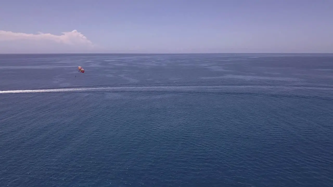 Aerial view of Parasail off of Oahu Hawaii on a clear sunny day