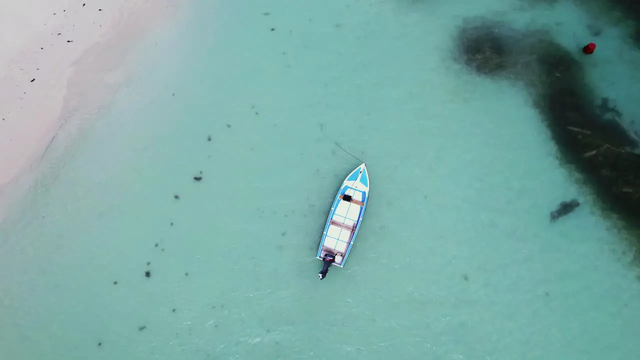 boat parked from above in Seychelles in 4k