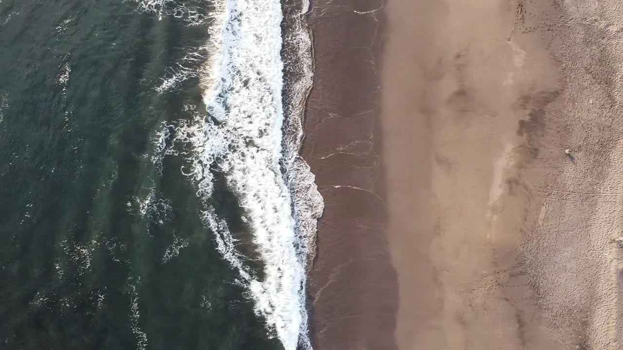 The Pacific Ocean waves splashing against the shore