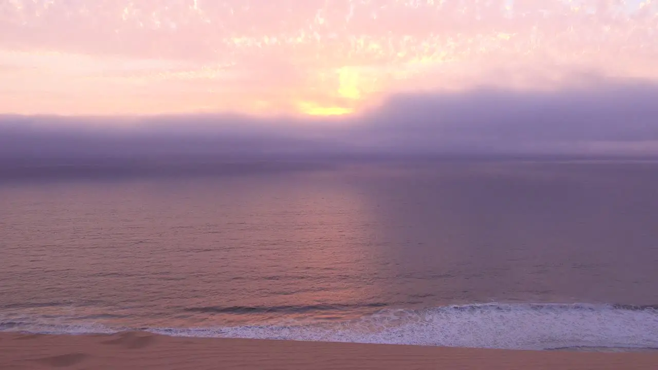 Moody sunset in the fog along the Skeleton Coast Namibia