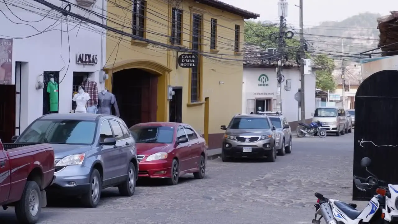 Tuk Tuk taxis drive rough cobble streets in jungle city in Honduras