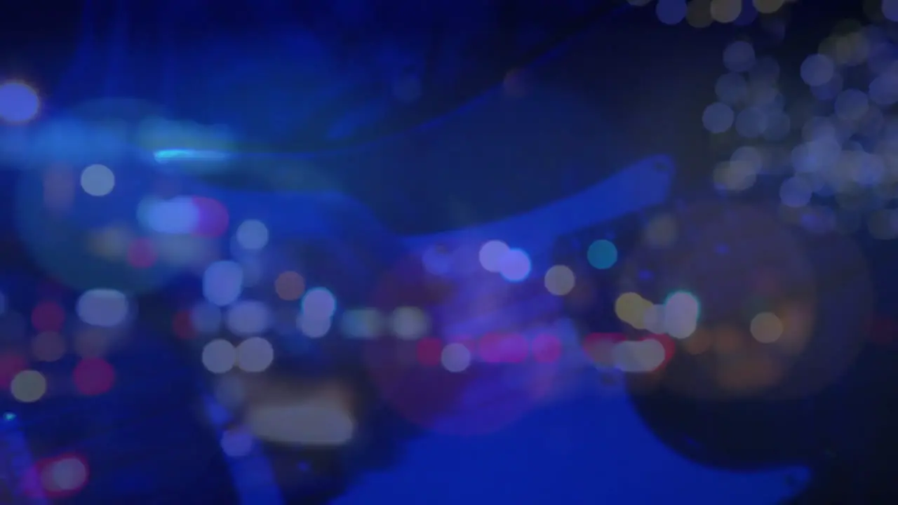 Caucasian female woman playing guitar during concert over city at night